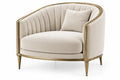 Beige and gold curved-line armchair by RidgeandRung, showcasing elegant upholstery and modern design in a stylish living room setting.