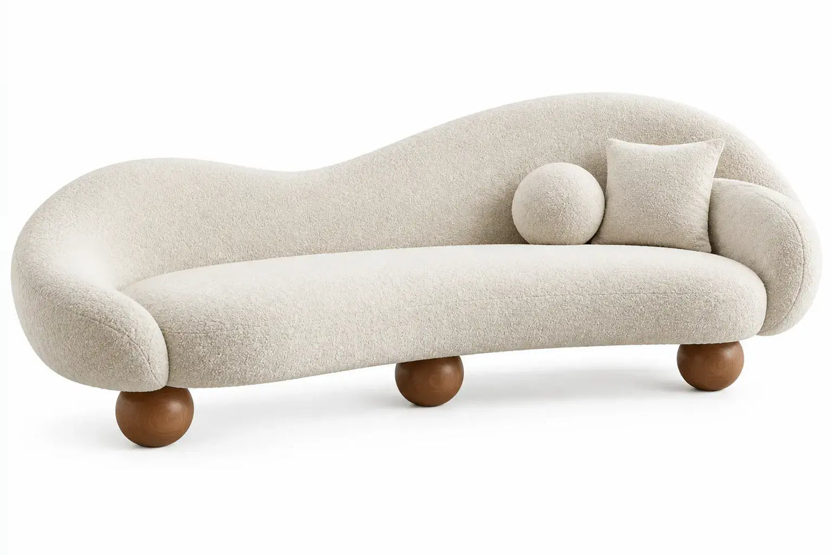White curved-line sofa from RidgeandRung with plush cushions and modern design, perfect for contemporary living rooms.